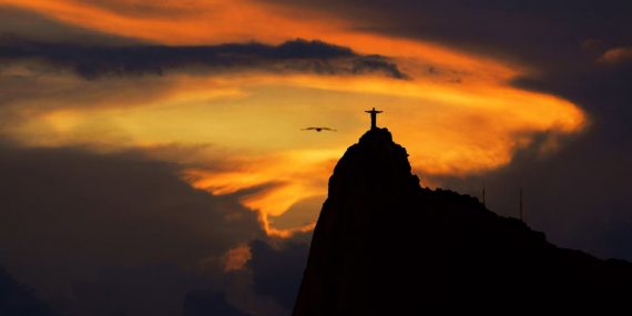 A captivating sunset silhouette of Christ the Redeemer in Rio de Janeiro, Brazil, exuding tranquility and beauty.